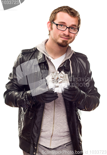Image of Warmly Dressed Handsome Young Man with Gift