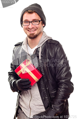 Image of Warmly Dressed Handsome Young Adult Holding Gift
