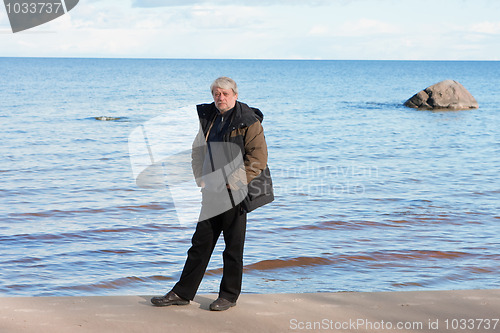 Image of Middle-aged man at the sea.