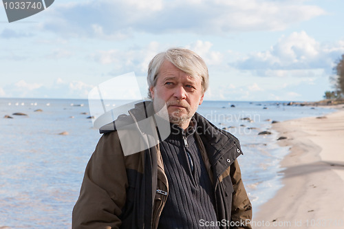 Image of Middle-aged man at the sea.