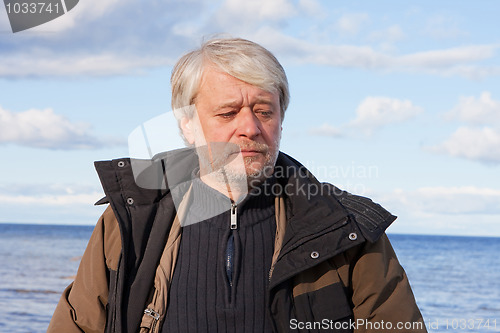 Image of Middle-aged man at the sea.