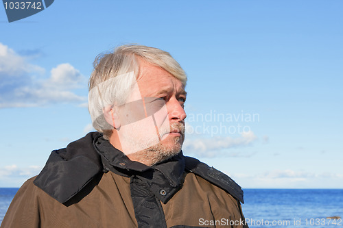 Image of Portrait of middle-aged man at the sea.