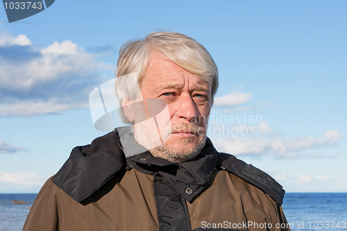 Image of Portrait of middle-aged man at the sea.