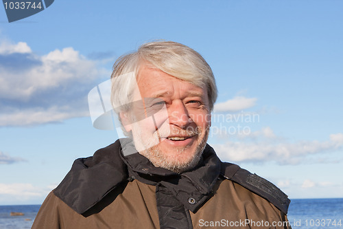 Image of Portrait of middle-aged man at the sea.