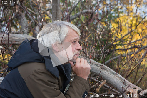 Image of Middle-aged man in forest.