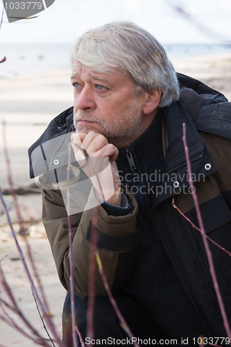 Image of Middle-aged man at the sea.