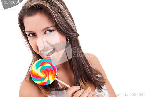 Image of beautiful young woman with a lollipop