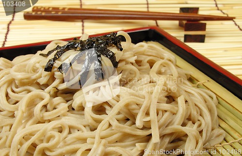 Image of Soba and chopsticks on a bamboo floor