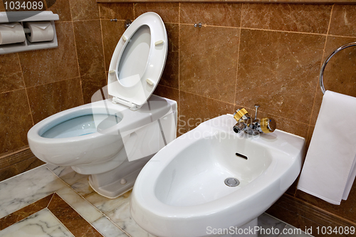 Image of Toilet and bidet in hotel bathroom