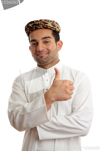 Image of Happy ethnic man thumbs up success