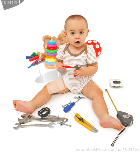 Image of Little boy with tools