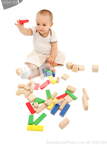 Image of Little boy playing with blocks