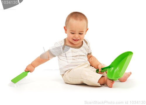 Image of Little boy sweeping