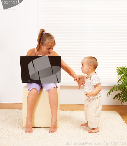 Image of Girl pushing away her brother