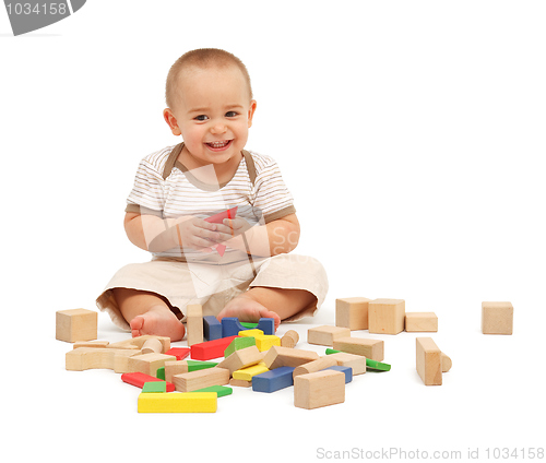 Image of Little boy playing with blocks