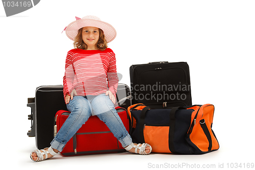 Image of Young girl with luggages