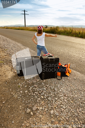 Image of Young hitch-hiker girl