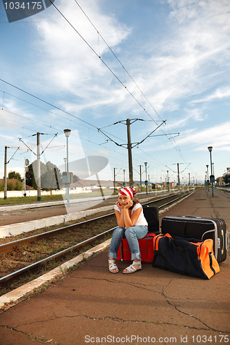 Image of Young girl in train station