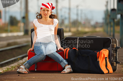 Image of Young girl in train station