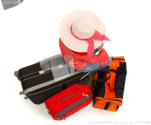 Image of Young girl with luggages