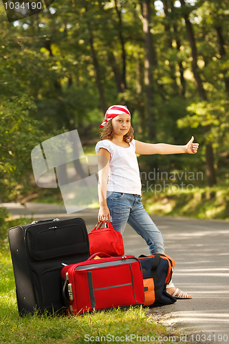 Image of Young hitch-hiker girl