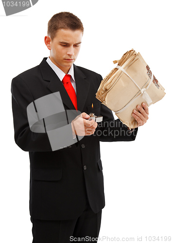 Image of Young man burning file folder