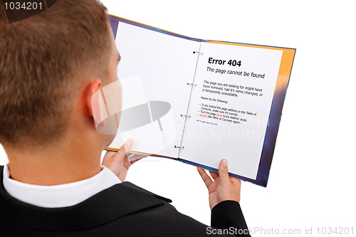 Image of Looking at 404 error page in book