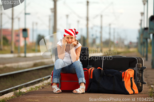 Image of Young girl in train station