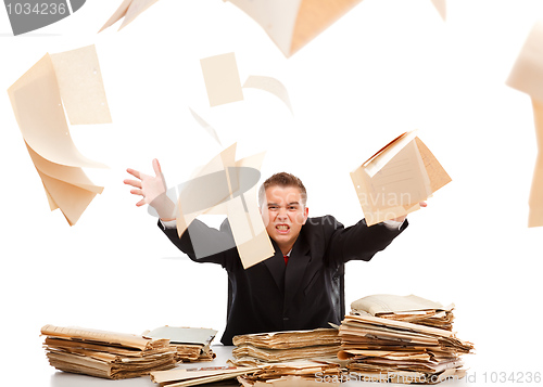 Image of Man throwing away paperwork