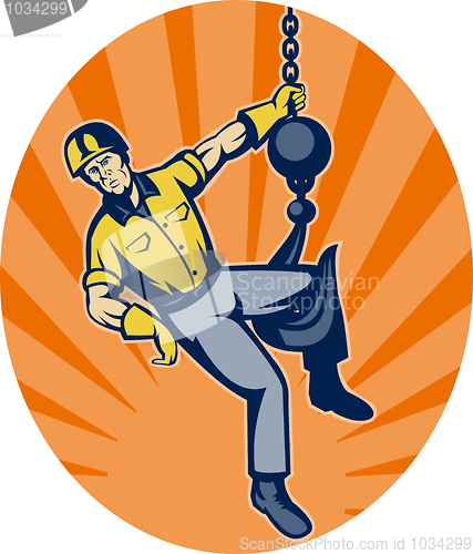 Image of Construction worker hanging on hook