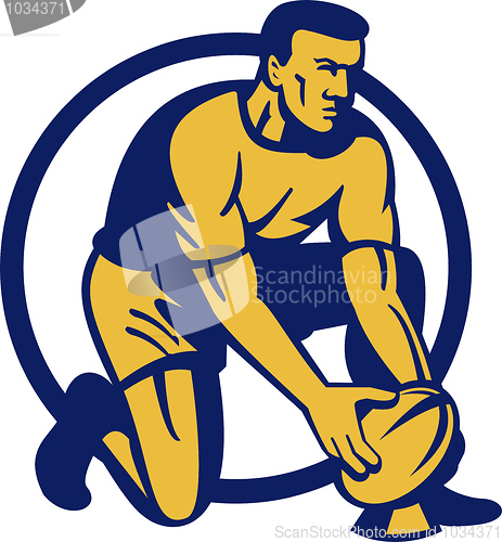 Image of Rugby player kneeling preparing a goal kick 