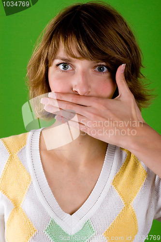 Image of woman with silence gesture 