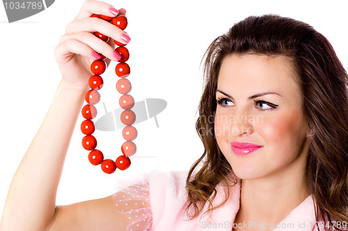 Image of  attractive brunet woman with red beads