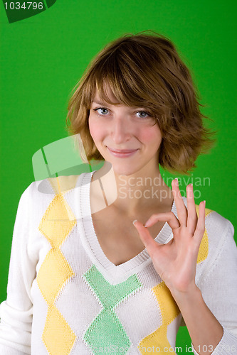 Image of woman showing ok gesture 