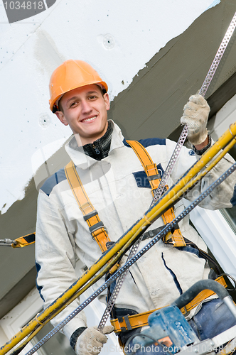 Image of happy facade builder worker