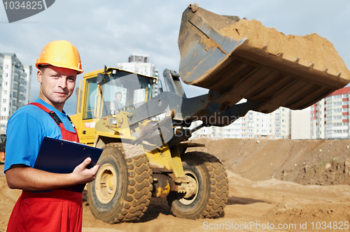 Image of smiling Builder inspector at construction area