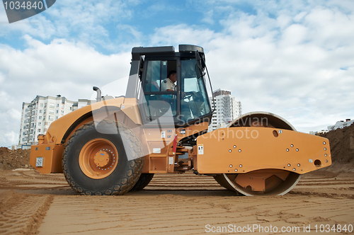 Image of soil vibration compactor at work