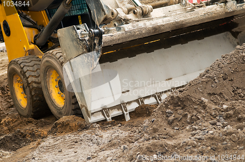 Image of skid steer loader works