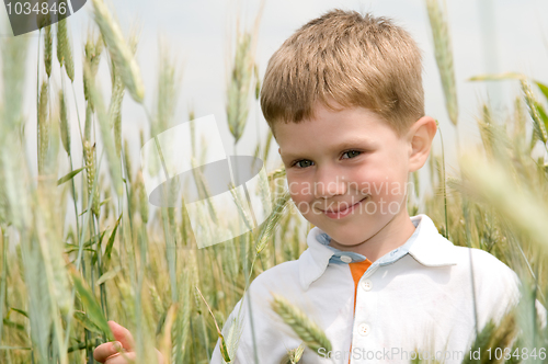 Image of smiling boy outdoors