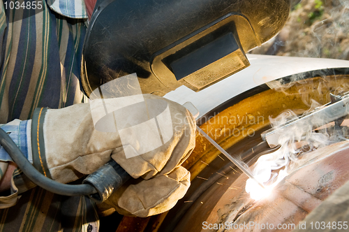 Image of close-up welder at work