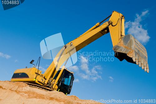 Image of track-type loader excavator at sand quarry