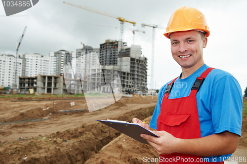 Image of smiling Builder inspector at construction area