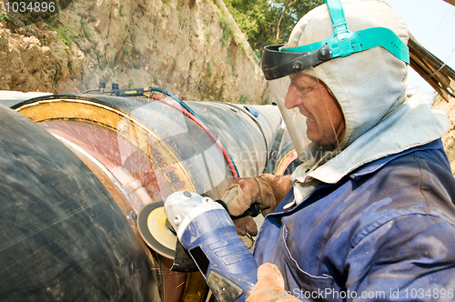 Image of worker and cutoff saw