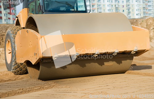 Image of soil vibration compactor at work