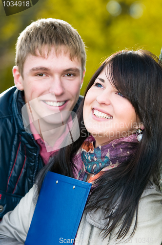 Image of Portrait of cheerful students outdoors