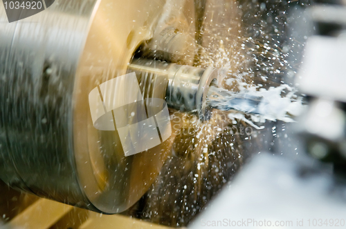 Image of drilling a hole in blank on turning machine