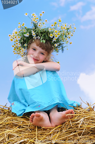 Image of Happy smiley girl with camomile wreath 