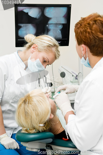 Image of dentist doctors at teeth treatment work