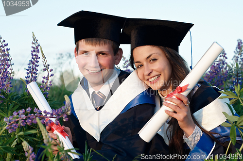 Image of Two Happy Graduate outdoors