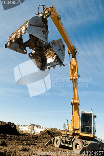 Image of wheel loader excavator at work